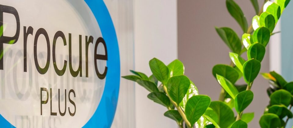 Procure Plus wall plaque logo.