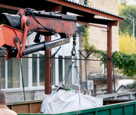 Waste collection vehicles and recycling containers supporting sustainable services through a social housing framework provider.